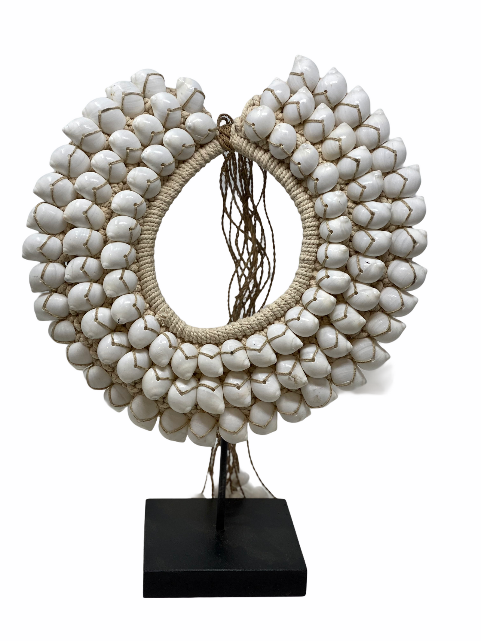 Handmade Indonesian white shell necklace on a display stand